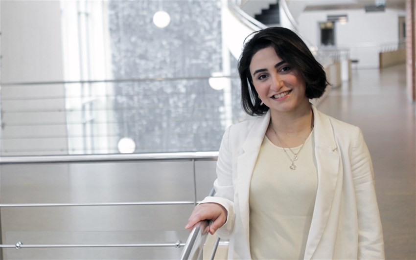 Woman next to staircase